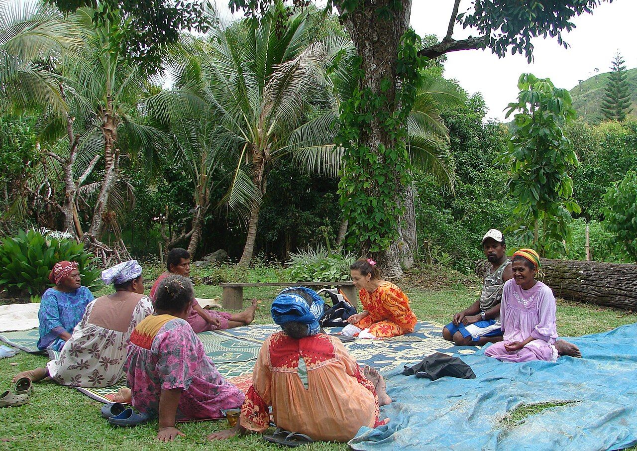 Community members and a linguist collaborating on a dictionary for a local language in New Caledonia