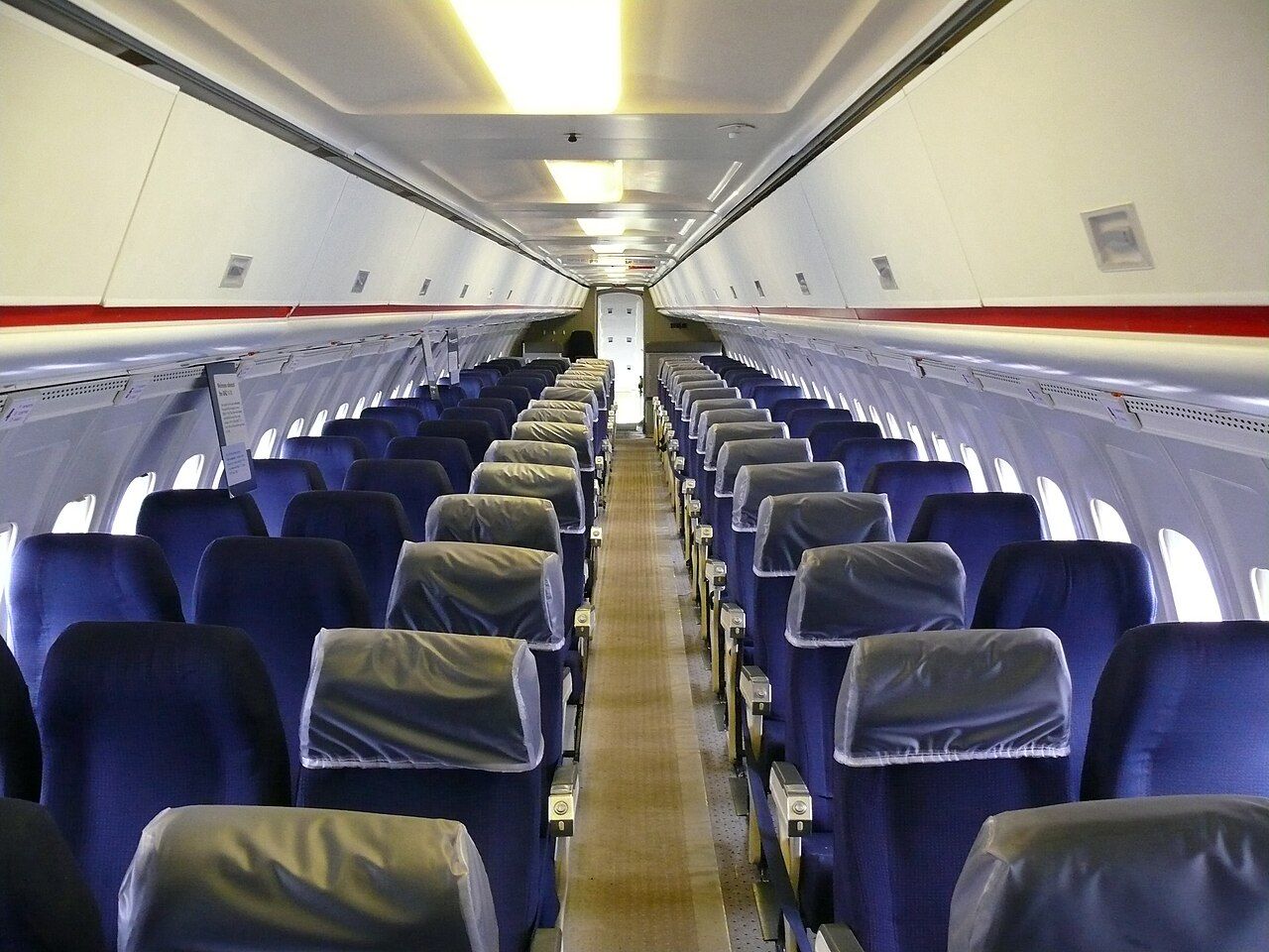 The flight deck of a commercial airliner showing two pilot seats side by side with identical instrument panels