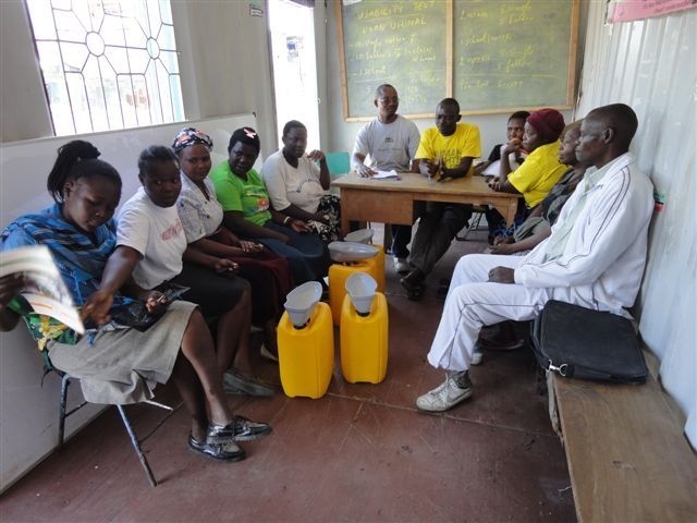 A small group of people seated in discussion, the everyday setting in which group pressure operates