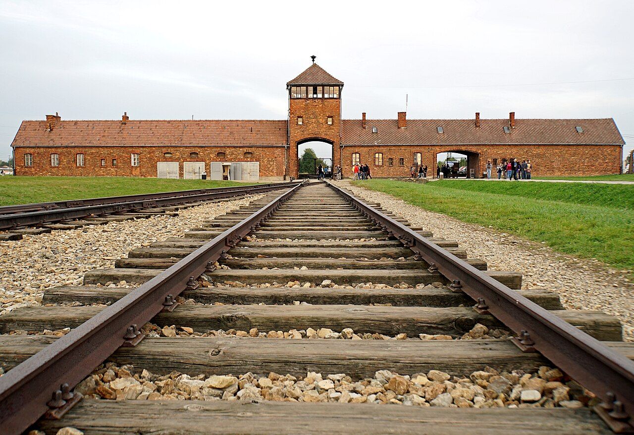 The railway gate at Auschwitz-Birkenau, where roughly 1.1 million people — the great majority of them Jews — were murdered.